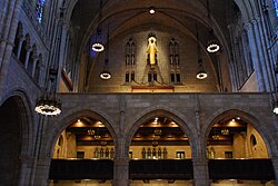 View of the galleries above the nave, looking south. The Trompeta Majestatis organ stop can be seen in the center of the eastern wall, with additional antiphonal pipes at left.