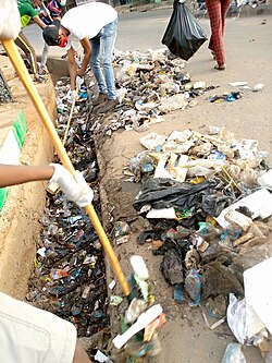 Volunteers clearing gutters in Ilorin, Nigeria during a volunteer sanitation day. Even when there is adequate infrastructure for sanitation, plastic pollution can prevent drainage and impede sewage flow.