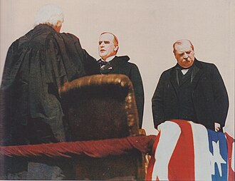 Outgoing President Cleveland, at right, stands nearby as William McKinley is sworn in as president by Chief Justice Melville Fuller.