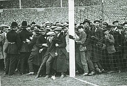 Crowds at the edges of the pitch