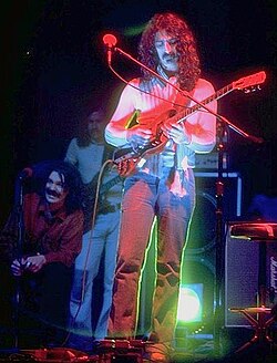 Zappa with Captain Beefheart, seated left, during a 1975 concert in New Haven, Connecticut