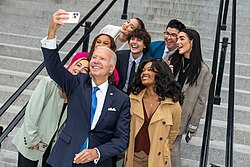 Biden taking a selfie with digital content creators in front of the Eisenhower Executive Office Building on October 25, 2022