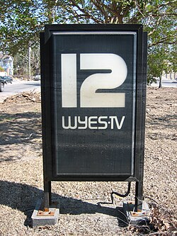 Sign in front of WYES' New Orleans studio building, with visible high water lines from Katrina's earlier flooding.
