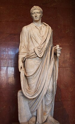 Full-length statue depicting Augustus as a magistrate. He holds a scroll in his left hand.