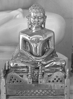 Abhinandananatha with his symbol of monkey below his idol