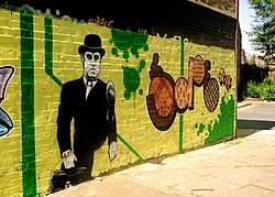 Graffiti of Cleese in "The Ministry of Silly Walks" sketch in Monty Python—Leicester, 2007