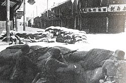German-trained National Revolutionary Army, 88th Division, defending a street intersection, Shanghai, 1937.