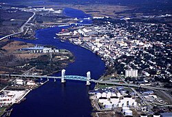 The Cape Fear Memorial Bridge (foreground) carries US 17 Business, US 76 and US 421 across the Cape Fear River