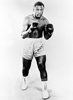 Joe Frazier in a studio portrait. Photo at least dated to 1971 based on this poster