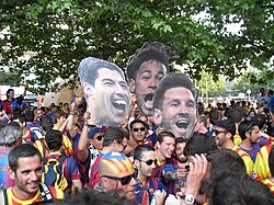 Barcelona fans prior to the 2015 UEFA Champions League Final in Berlin holding up pictures of the attacking trio, Messi, Suárez and Neymar (MSN)
