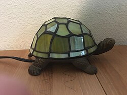 Electric lamp in the shape of a turtle