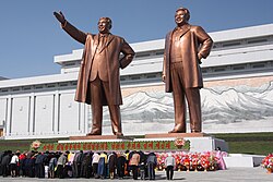 People bowing to the statues of Kim Il Sung and Kim Jong Il, April 2012