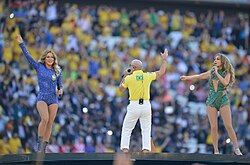From left to right: Claudia Leitte, Pitbull, and Jennifer Lopez performing at the opening ceremony at the Arena de São Paulo, São Paulo.