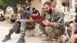 Major Yasser Abdul Rahim, commander of Fatah Halab and field commander of the Sham Legion in Aleppo, coordinates an attack on YPG positions in Aleppo, 2 October 2015.