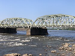 The eastern half of the Lower Trenton Bridge lies within Mercer County and harks to Trenton's longstanding role as a diverse manufacturing hub.