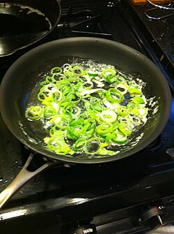 Fresh leeks sautéing