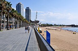 Part of the beach promenade and the beach of La Barceloneta towards Port Olímpic