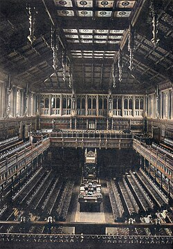 The old House of Commons chamber, showing a very dark veneer on the wood, which was purposely made much brighter in the new chamber